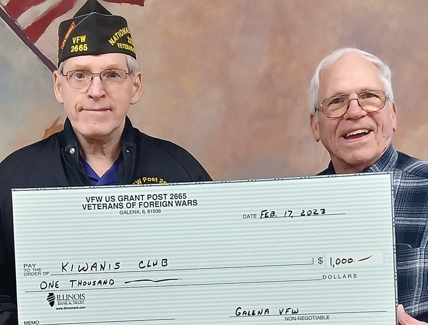 Galena VFW Post 2665 Comdr. George Petitgout presents a $1,000 check to Ty Cocagne, Galena Kiwanis treasurer. The VFW is supporting the club&rsquo;s Run for the Parks which will benefit the Bouthillier Street Park.