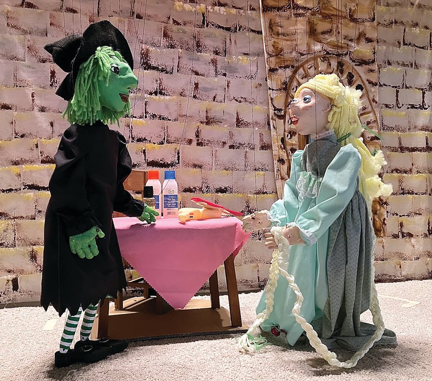 Witch Hazel Green &ldquo;chats&rdquo; with Rapunzel in Fever River Puppeteers&rsquo; production of Rapunzel.