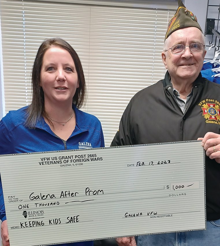 Galena VFW Quartermaster Dick Wearmouth, right, presents a $1,000 check to Jolene Northrup, Galena After Prom Committee member, left, to support a fun, safe, drug and alcohol-free after-prom environment for Galena High School students.