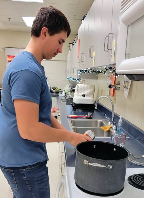 The River Ridge FFA organized a number of fun activities during National FFA Week for members, other students and faculty and staff. Here, Lucas Holland begins preparations for the teacher and staff appreciation breakfast.