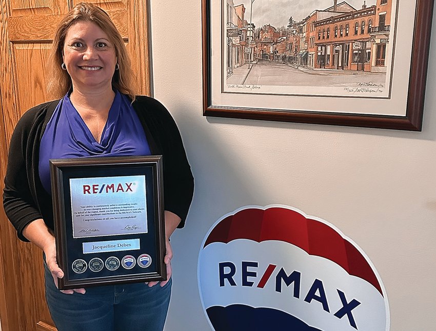 Jackie Debes, owner, and Designated Managing Broker, of RE/MAX Prime Properties of Galena has recently received an award and recognition in the RE/MAX 100% Club for 2022. The RE/MAX 100% Club recognizes individuals and teams who earned $100,000 to $249,999 in gross commissions. RE/MAX has over 135,000 agents in more than 110 countries and territories. Above: Debes poses with her RE/MAX plaque.