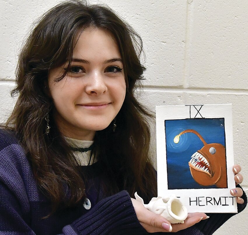 Julia Pellegrino is the artist of the month at Galena High School. The junior is photographed with her ceramic fish and her tarot card of an anglerfish. Pellegrino said that her inspirations for both pieces are, &ldquo;my hobbies and interests.&rdquo; She likes to create art with a variety of mediums such as watercolors, acrylic paints, or clay. She adds, &ldquo;I like making art that includes my interest of nature, or what else I am interested in at the time.&rdquo; She thinks art is important because it gives people a needed creative outlet to express themselves.