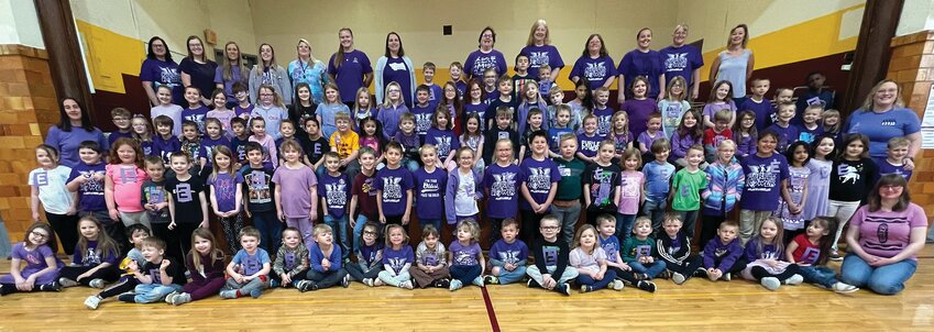 Stockton&rsquo;s elementary schoolers came together in their purple shirts for a photo in remembrance of Eli Henderson.