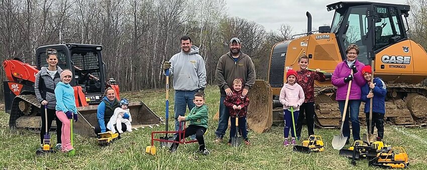 On Sunday, April 23, groundbreaking was held for Golfview Estates Phase II, Lots 1-18. Manning the equipment are developers Ben and Nick Wienen, along with their helpers Millie, Eldie, Samuel, Henry, Lucy, Thomas and Brady Wienen. Also looking on are supervisors Tilli, Cassie and Connie Wienen.