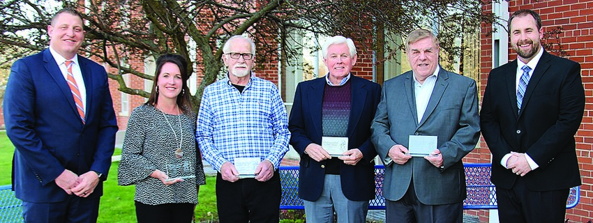 Four of the six recipients of the Pirate Pride Award for Distinguished Alumni. From left: Superintendent Tim Vincent, Tracy Bauer &lsquo;92, Pete Kieffer &lsquo;61, John Cox &lsquo;65, Dennis Davenport &lsquo;65 and Damon Heim, a member of the Galena Education Foundation. Not pictured: Brandon Behlke &lsquo;11.
