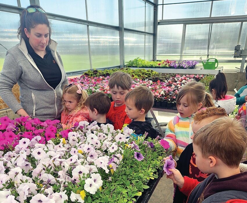 The ARC Preschoolers visited the Galena High School Ag Department&rsquo;s Greenhouse Wednesday, April 26. From left: GHS Ag Teacher Sarah Lee, Shiloh Hackney, Bryson Burken, Wes Loeffelholz, Sawyer Willey, Magenta Anderson, Tyson Wienen, and Everett Sproule.