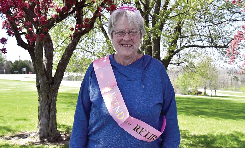 Sue Meusel with her &ldquo;The legend has retired&rdquo; sash.
