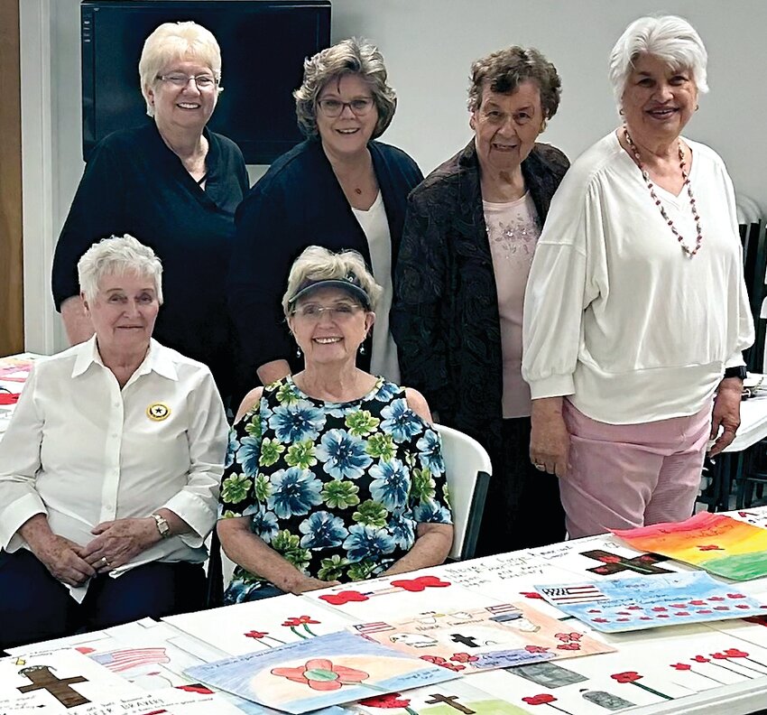 On April 13 Galena American Legion Auxiliary members, back, from left, Pat Halstead, Kimberly Howard, Helen Caroll, Bev Mellskog; and front, from left, Rita Wohlers, Maureen Knipschield, inspect entries for the annual poppy poster contest for students in fourth through 12th grades. Galena School District winners include Ashton Sproule , 17, senior; Gracie Dutlack, 15, sophomore; Emma Duncan, 15, freshman; Maddie Ehrler, 12, seventh grade; Noelle Ottenhausen, 11, fifth grade; and Jenna Nack, 11, fifth grade. The posters from these students will be entered into the state contest. The contest is designed to help young people learn the significance of the Memorial Poppy. Its purpose is to honor the memory of soldiers who died in World War I. The Galena American Legion Auxiliary members judged more than 50 posters.