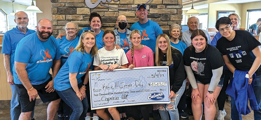 Galena Culver&rsquo;s hosted a Share Night for Katie McIntyre on Tuesday, May 2 raising $4,543.07, which includes $3,000 in cash donations. Participating in the check passing are, back, from left, Marc McCoy, Elly Renner, Amy McCoy, Katie McIntyre, Brian McIntyre, Kay McIntyre, Terry Renner, Holly Niles; and front, from left, Nate McCoy, Tiffany Droessler, Paige Monahan, Ally Basten, Mikayla Knautz, Summer Belken and Oliver Ortega.