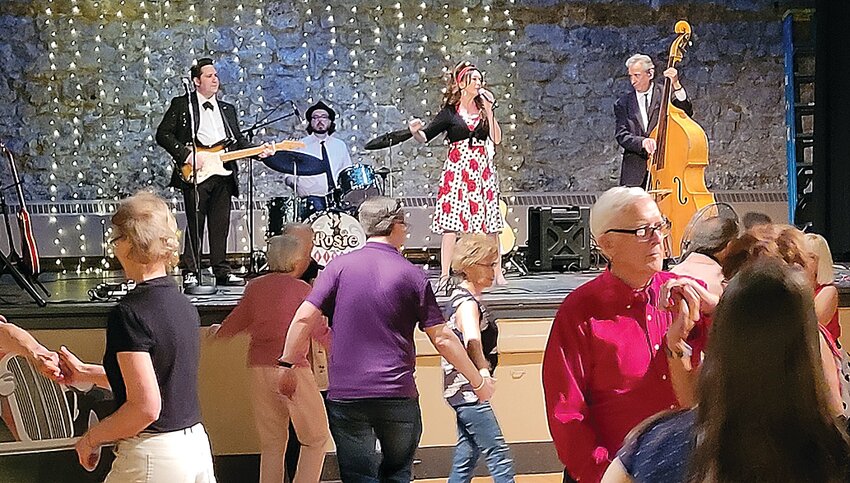 On Saturday, May 13, there was a 50s Sock Hop at Turner Hall. Attendees danced the night away to music by Rosie and the Rivets. Here, Rosie and the Rivets perform at the sock hop.