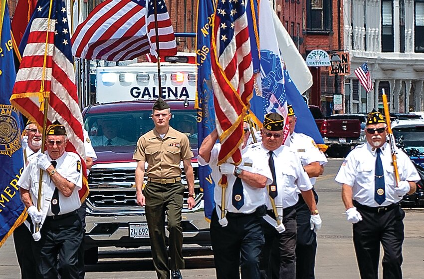 Members of the American Legion and Veterans of Foreign War (VFW) color guard march down Main Street Galena toward the Memorial Day Services.