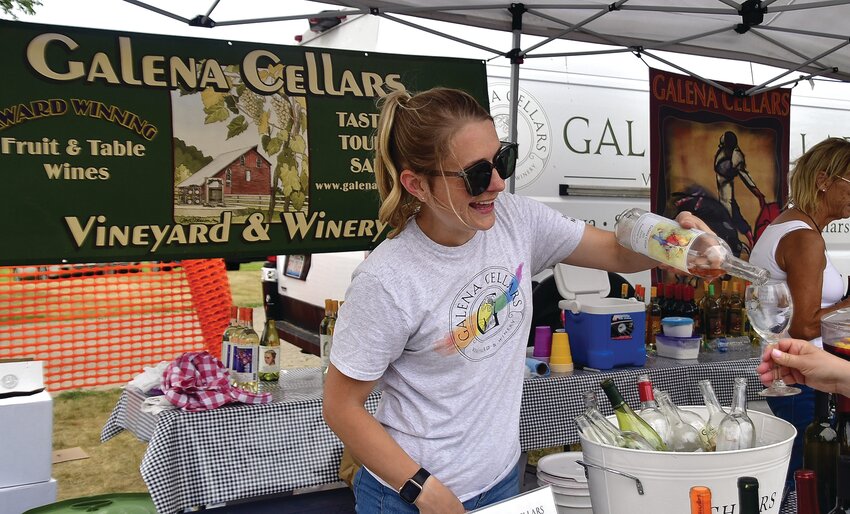 Britt White pours wine at the Galena Cellars tent.