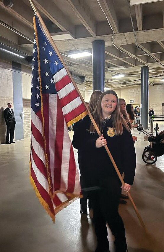 Heaven Brotherton was honored to carry one of the American flags during the opening ceremonies after being named one of the top 10 chapter reporters in the state.