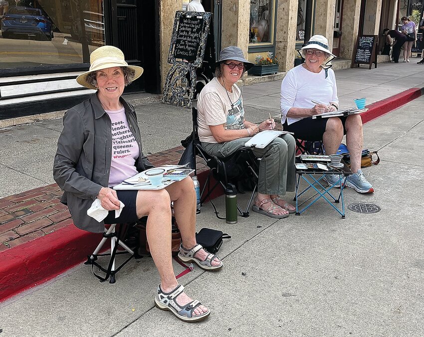 On Monday, July 24 Donah Gehlert, an Ohio native; Lana Caywood, Platteville resident and member of the Dubuque Urban Sketchers; and Sue Strickler, Platteville resident, decided to spend the afternoon sketching and painting the buildings of downtown Galena. The three ladies are participating in an activity where you sit down and sketch whatever is there.