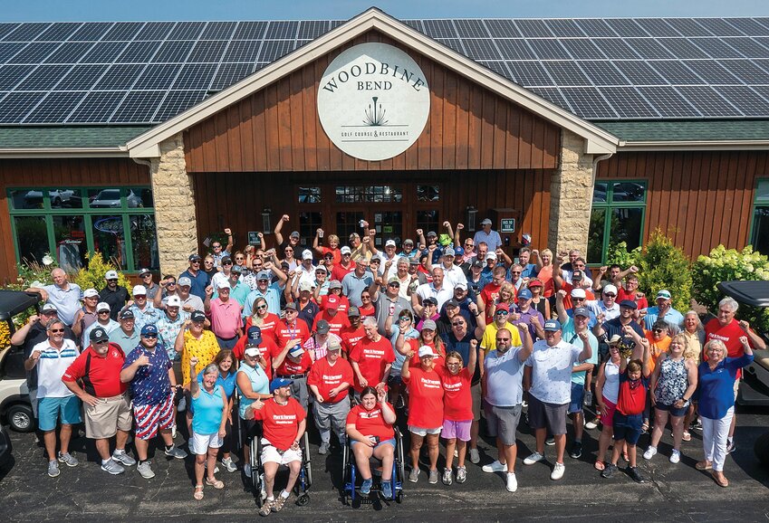 Left: A huge number of golfers turned out in support of the Woodbine Bend Golf Course and Restaurant&rsquo;s annual &ldquo;Play it Forward&rdquo; benefit tournament, Saturday, August 5. Initially formed in 2002 to support ALS Foundation research (Lou Gehrig&rsquo;s disease) the Stoddard family, owners of Woodbine Bend, adapted the tournament in 2013 to support causes and needs in Jo Daviess County. Except for a two-year hiatus due to the COVID pandemic the benefit tournament resumed in 2022 for a total of 19 years, raising over $150,000.00 to date. This year&rsquo;s event was held in support of Kreider Services of Jo Daviess County to bring their housing into the 21st century, which is in need of repair and regeneration. The mission of Kreider Services since 1952 is to &ldquo;Provide meaningful supports to people with disabilities to live, work and participate in their community.&rdquo; Fundraising results will be released at a later date. Here, members of the Stoddard family, Kreider employees and residents of their group home raise their arms in enthusiasm during the tournament.