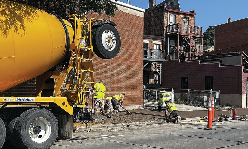 On Thursday, August 10, Louie&rsquo;s Trenching Service&rsquo;s workers continued to reconstruct the sidewalks in downtown Galena by excavating the broken concrete and replacing it with new pavement. Here, workers finish smoothing the new sidewalks.