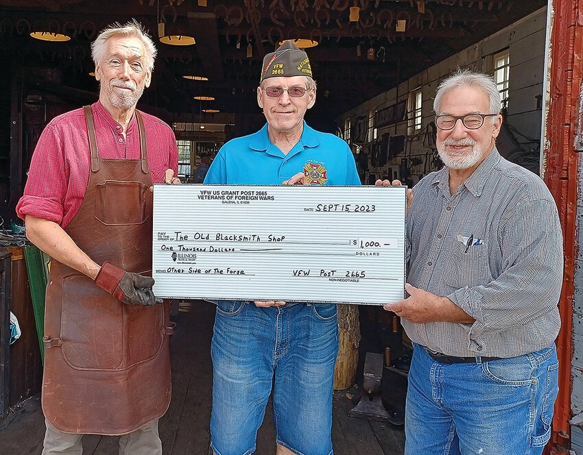 From left: Tom Lobacz, George Petitgout, Rich Tickner with the check.