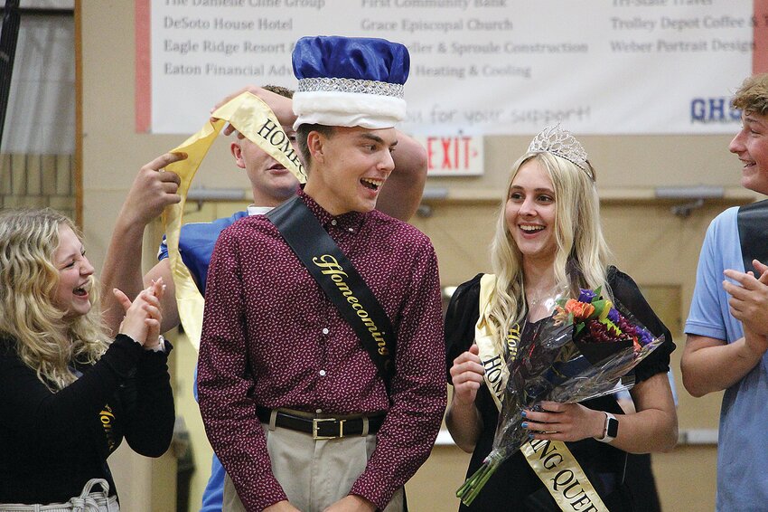 Left: During Skit Night, on Oct. 4, seniors Charlie Duncan and Mikayla Knautz were crowned this year&rsquo;s Homecoming King and Queen. Fellow Homecoming Court members Kiera Linenfelser (far left) and Frank Ciangi (far right) cheer them on as they receive their crowns and sashes. Contributed by Susan Bookless.