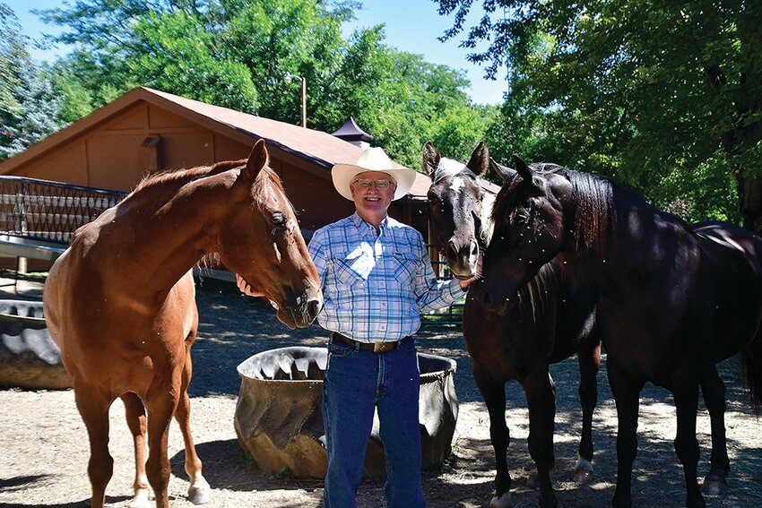 Joe Berning with three of his horses.