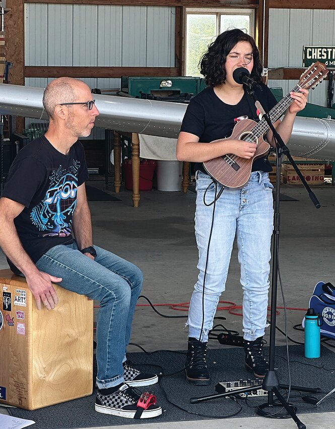 Liliana Asta performing at Orchard Landing and Cider Co. on Sunday, Sept. 17. Dad Jim Asta is on percussion.