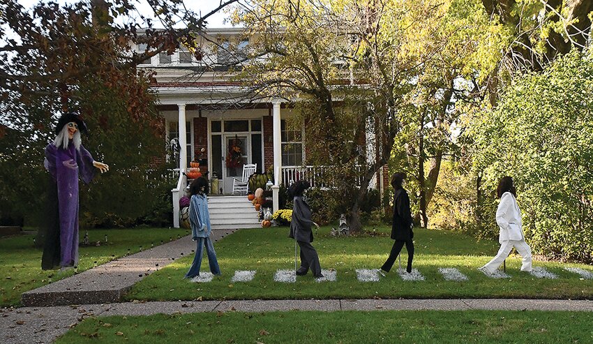 A house on Park Ave. depicts the Abbey Road album cover but, plot twist, the Beatles are zombies.