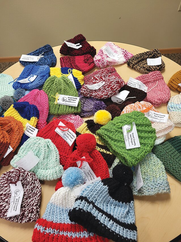 These hats have been made by members of the Grant County Hat Project.