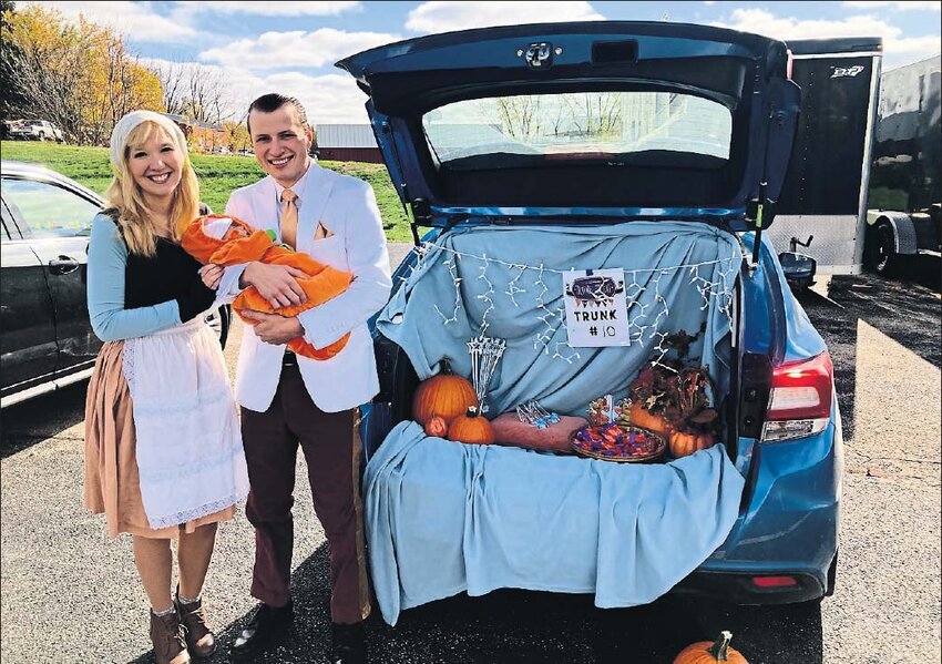 The Caswell family went with a Cinderella pumpkin patch theme with Briana Caswell as Cinderella, Austin Caswell as Prince Charming and baby Lydia Caswell as a pumpkin.