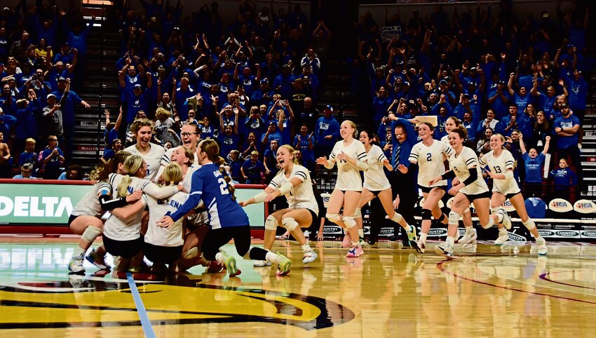The bench clears as team members rush to celebrate Galena&rsquo;s first-ever volleyball state championship. All Milly Jones photos
