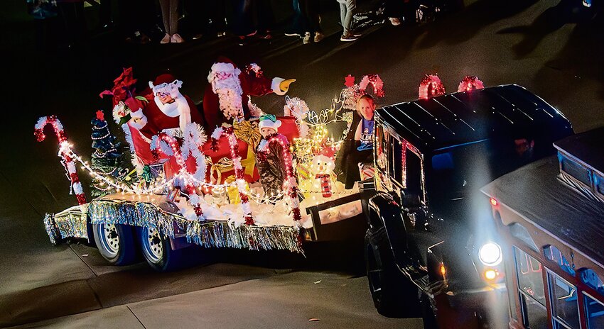 Santa and Mrs. Claus arrived in downtown Galena Saturday evening, Nov. 25. Their sleigh made its way through crowds of young and old spectators at the end of the festive annual Jeep Jingle Parade.