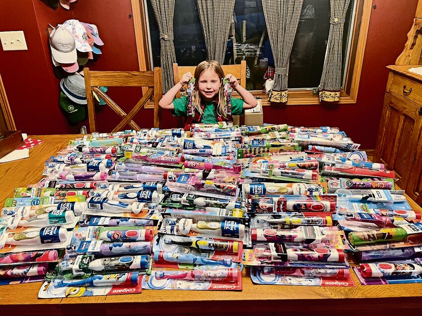 Kate Redfearn at home with the toothbrushes she collected for the University of Iowa Stead Family Children&rsquo;s hospital.