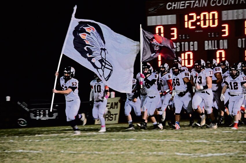The team enters the field during a playoff game leading up to the championship.