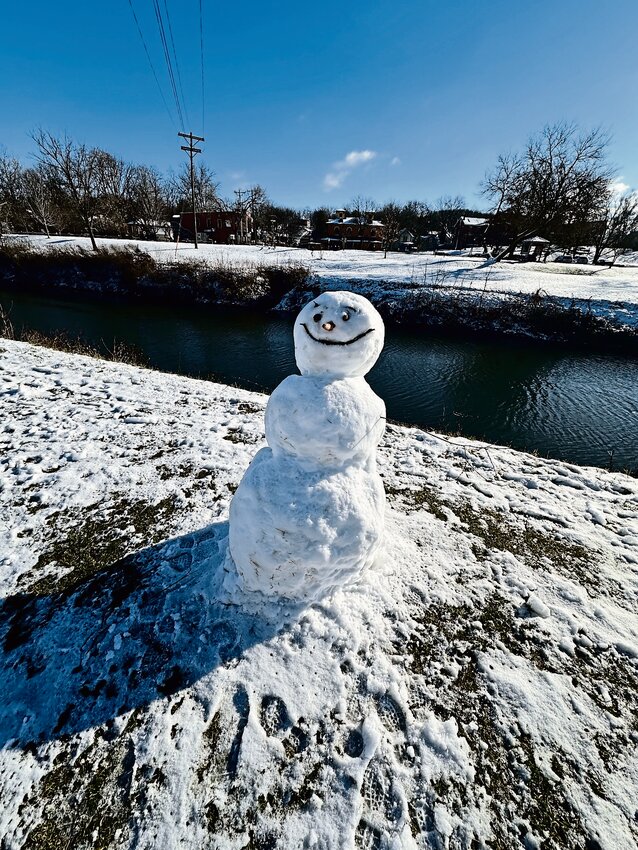 A snowman on the levee.