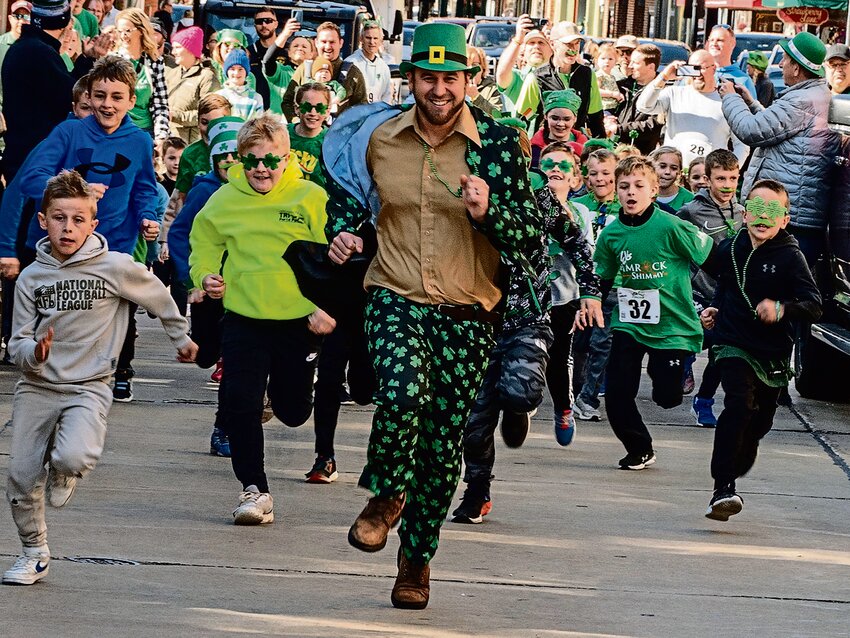 The Galena Elks official leprechaun, Michael Decker, was chased down Galena&rsquo;s Main Street by a large group of children as he led them in the Elks Mini Shamrock Shimmy race March 16. More photos and coverage of the St. Patrick&rsquo;s Day festivities are on page 17 and 19.