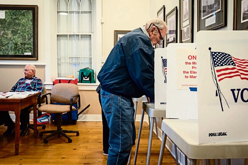 Bob Strahlman votes beside his wife, Sharon, in the March 19 General Primary at the East Galena Town Hall.