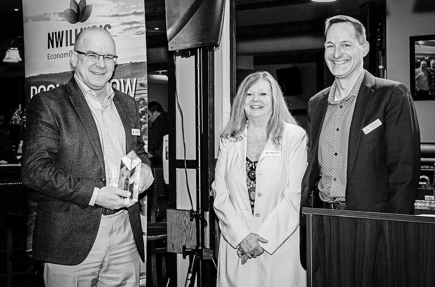 NWILED Board Member of the Year award went to Joe Mattingley. Pictured from left are:  Mattingley of the NWILED Board and JCE Co-op Board, Barbara Sue Schubert of NWILED and Mike Casper of the NWILED Board and JCE Co-op.