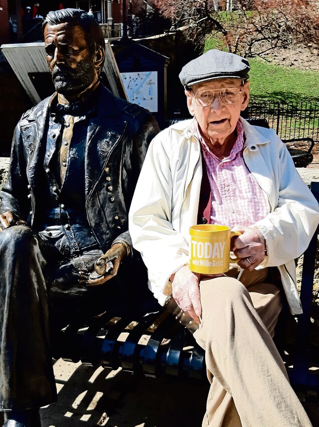 Wayne Haas posing with another famous Galenian, U.S. Grant. Grant and Haas are separated in age by 100 years. Haas&rsquo;s birthday is April 25 when he will be 102 years old, and Grant&rsquo;s is April 27. Wayne is holding his  &ldquo;Sunday Today&rdquo; mug in hopes of being featured on the Sunday morning news show with Willie Geist.
