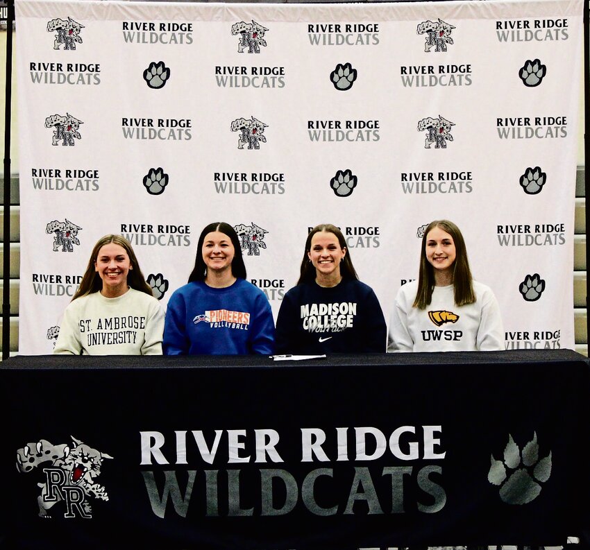 Four River Ridge seniors signed on to college athletic commitments on April 26. Evelyn Walters will play softball at St. Ambrose University; Addison Albrecht will play volleyball at the University of Wisconsin - Platteville; Amie Richmond will play softball at Madison College; and Gwen Miller will run track at the University of Wisconsin - Stevens Point.