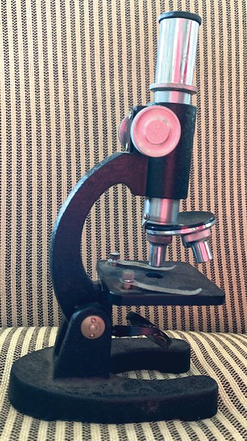 The microscope the author saved her allowance for when she was 10.