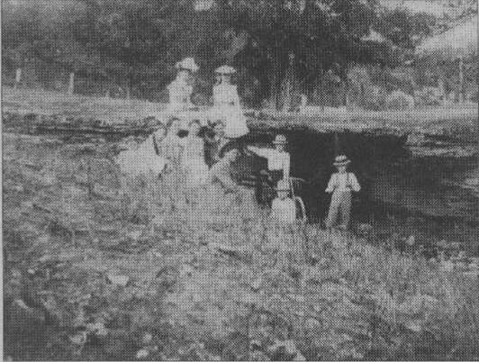 A group gathers at The Natural Bridge, which was a popular site for picnics. 