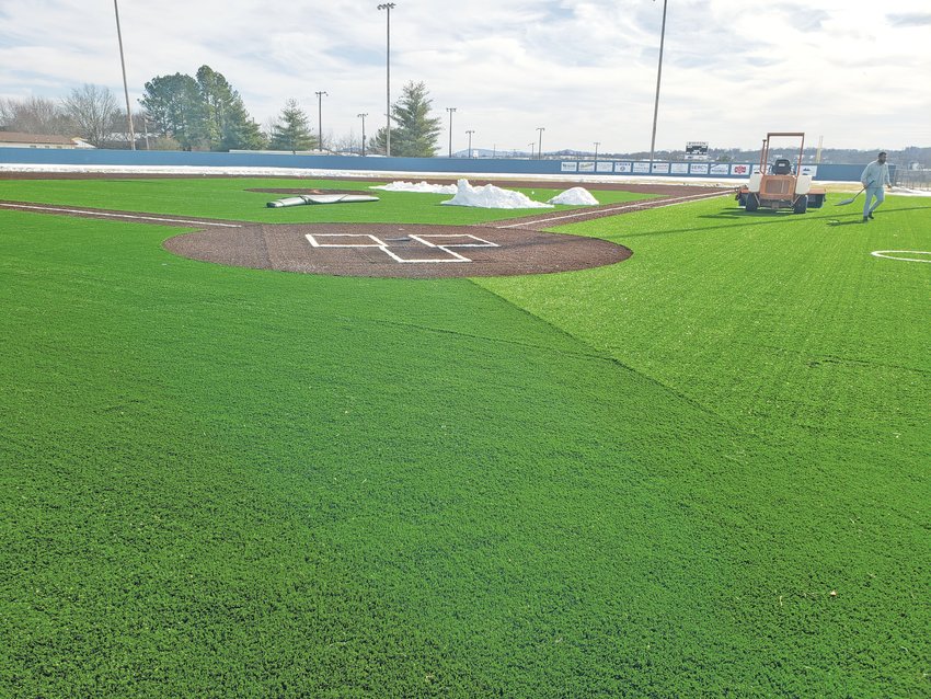 Workers with Mid America Sports Construction of Lee&rsquo;s Summit, Missouri, were doing what they could in cold temperatures last week to install artificial turf on fields at the Equity Bank Sports Complex.