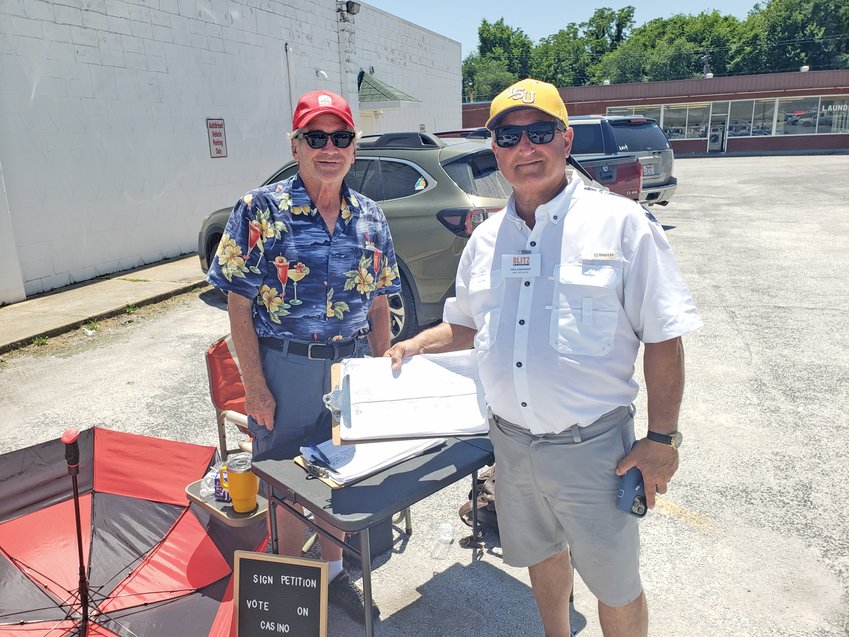 Johnny McMahan, a past mayor of Bauxite, and Pat Roberts were outside the Boone County Election Center in the 90-degree heat Tuesday afternoon collecting signatures to allow voters a second chance at voting on casinos that had previously been approved in Arkansas.