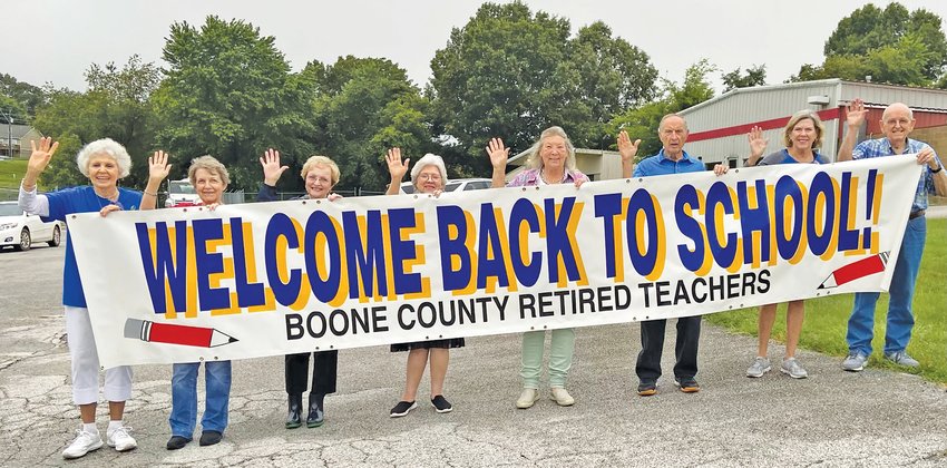 Retired teachers (from left) Beverly Bear, Amy Young, Jane Adair, Ann Hutcheson, Barbara Halsted, Claude Whited, Jan Walker, and Charles Adair welcomed students back to school.
