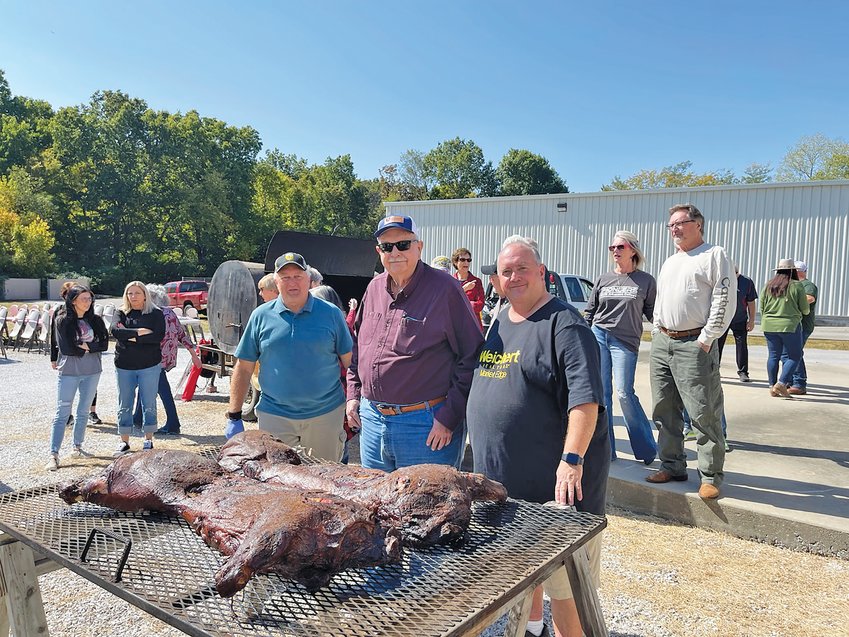 Donna Braymer/Staff&nbsp;&nbsp;&nbsp;    Paul (left), Jim and Franklin Harp hosted another pig roast for the community and to make the retirement announcement of Jim Harp official.