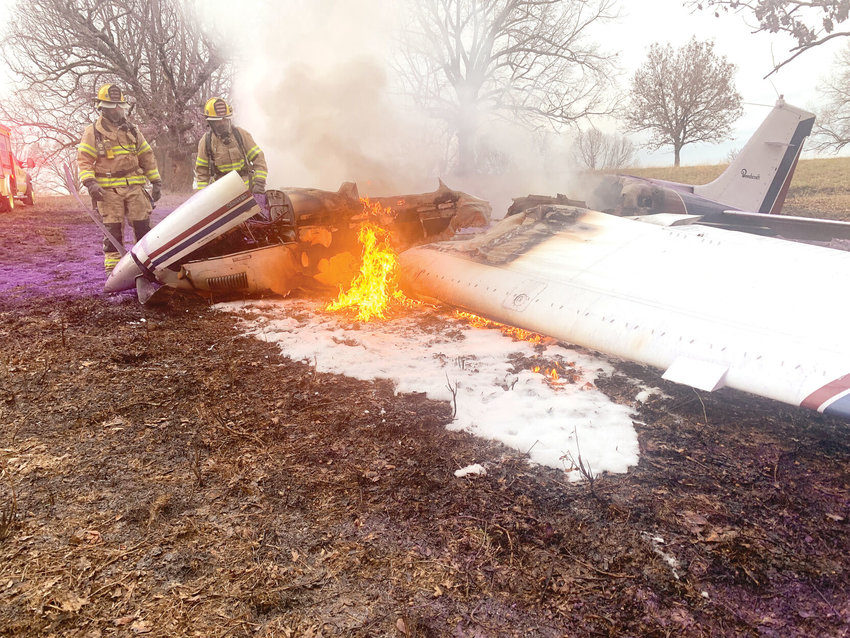 The Harrison Fire Department used fire and rescue apparatus from the airport fire station to extinguish the blaze on a Beechcraft Bonanza aircraft after it crash landed near the Boone County Regional Airport on Monday. Both pilot and passenger were treated for minor injuries and released. CONTRIBUTED PHOTO/LEE H. DUNLAP
