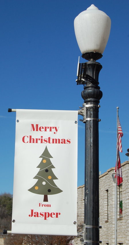 Jeff Dezort/Staff   Holiday banners decorate the Jasper square just in time for the Christmas Market set for Saturday, Dec. 10.