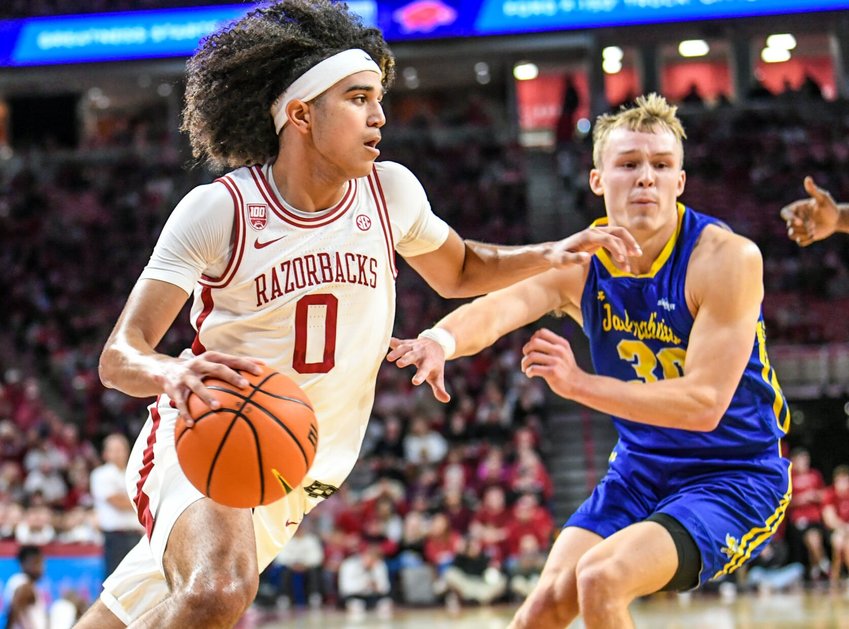 CRAVEN WHITLOW/NATE ALLEN SPORTS SERVICES   Arkansas freshman guard Anthony Black drives to the basket against South Dakota State on Wednesday night at Bud Walton Arena. Black scored five points in the 71-56 win and the Razorbacks remain undefeated in the early season.