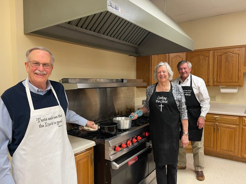 Cooks   DONNA BRAYMER/STAFF   Fred Kirkpatrick (left) and Celia Allen, both First Presbyterian Church members, share the kitchen with Ken Reeves of First Christian Church as the two congregations prepare for Lenten Lunches.   &nbsp;