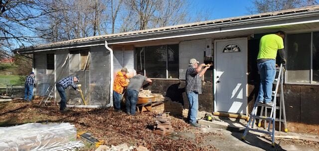 Volunteers from The Home Depot and Camp Jack team up to repair a home that had been severely      damaged during a car accident. The home belongs to a mother and daughter, both Navy veterans. The Home Depot donated all the materials. CONTRIBUTED PHOTO