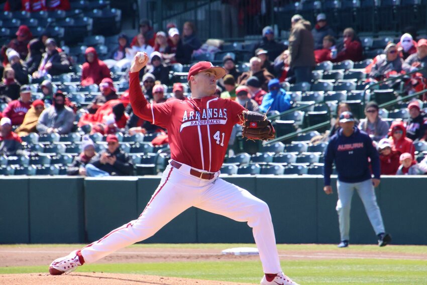 Will McEntire of the Arkansas Razorbacks delivers a pitch for the Hogs. Arkansas starts a three-game series at LSU after completing an 18-game homestand. JOHN JAMES/NATE ALLEN SPORTS SERVICES