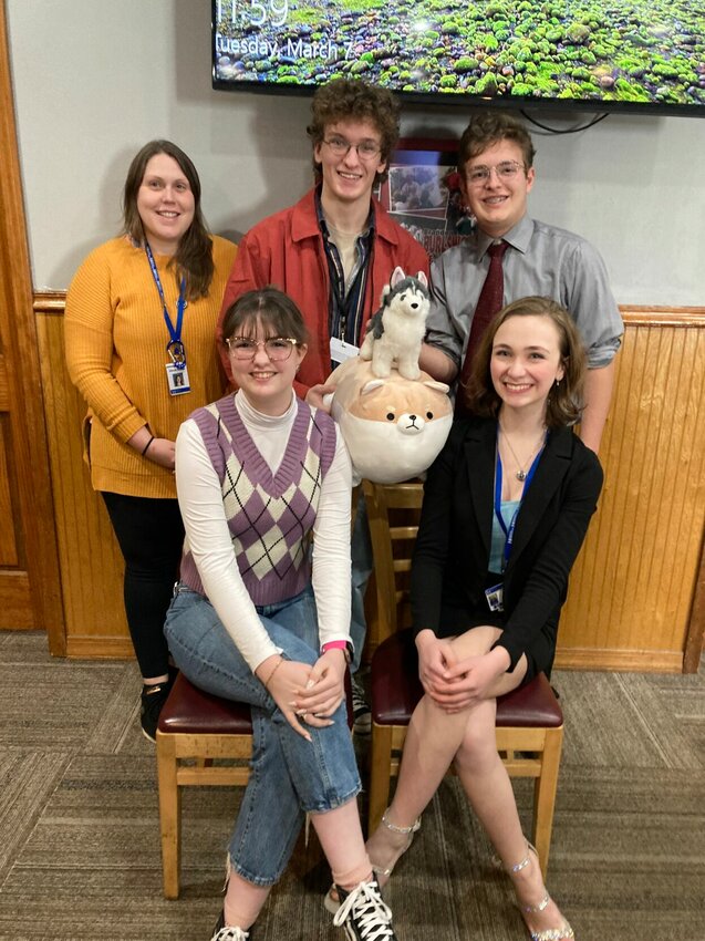 Guests (from left) Julianna Hamblin, Isaiah Wallis, Mark Green, Brinkley Brewer, and Emma Bock show humor and theater enthusiasm with their two &ldquo;doggie&rdquo; friends and props for their excellent fun performance at the March BNCRTSS meeting.